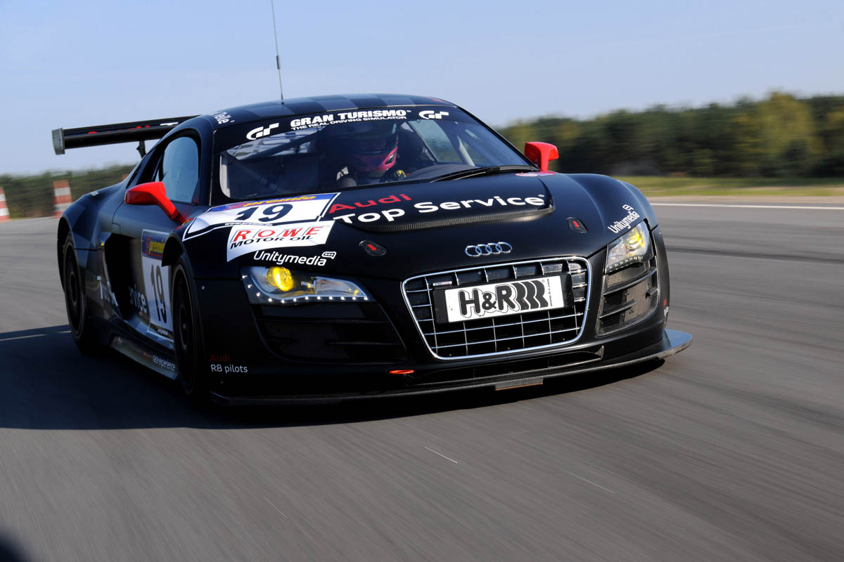 evo races an Audi R8 LMS at the Nurburgring 24 hours