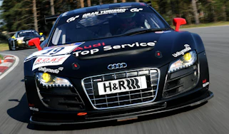 evo races an Audi R8 LMS at the Nurburgring 24 hours