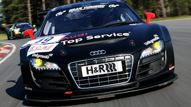 evo races an Audi R8 LMS at the Nurburgring 24 hours