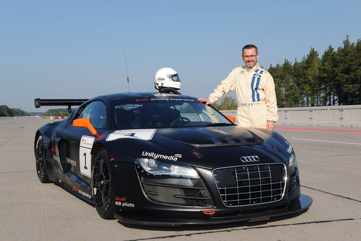 evo races an Audi R8 LMS at the Nurburgring 24 hours
