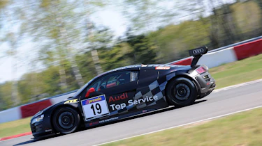 evo races an Audi R8 LMS at the Nurburgring 24 hours