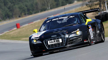 evo races an Audi R8 LMS at the Nurburgring 24 hours