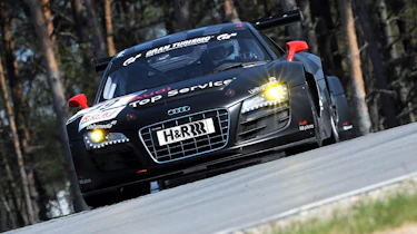 evo races an Audi R8 LMS at the Nurburgring 24 hours