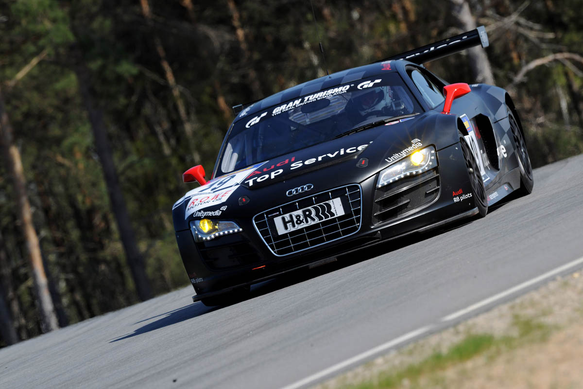 evo races an Audi R8 LMS at the Nurburgring 24 hours