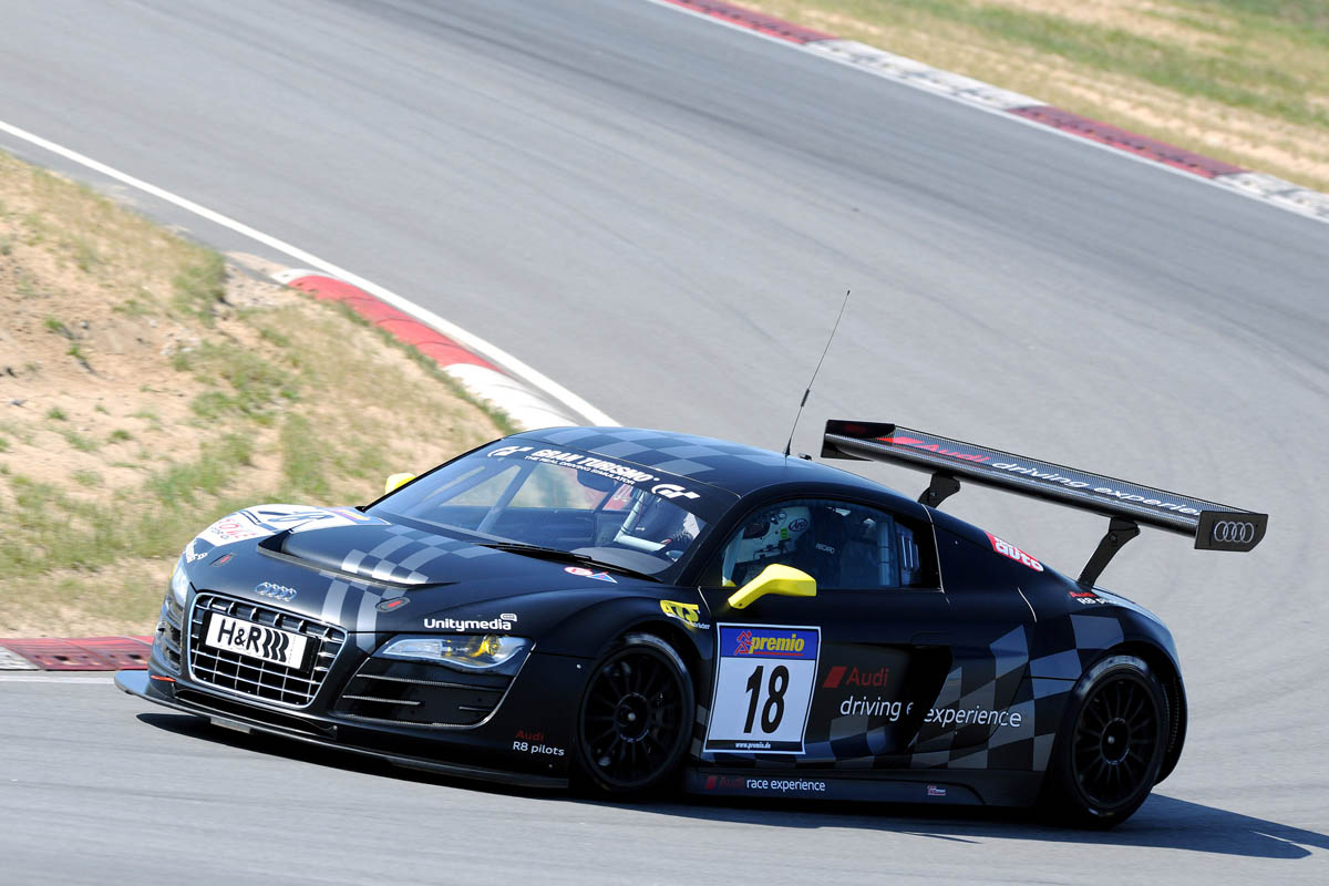 evo races an Audi R8 LMS at the Nurburgring 24 hours