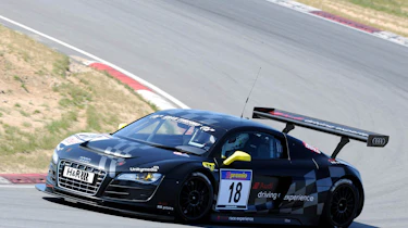 evo races an Audi R8 LMS at the Nurburgring 24 hours