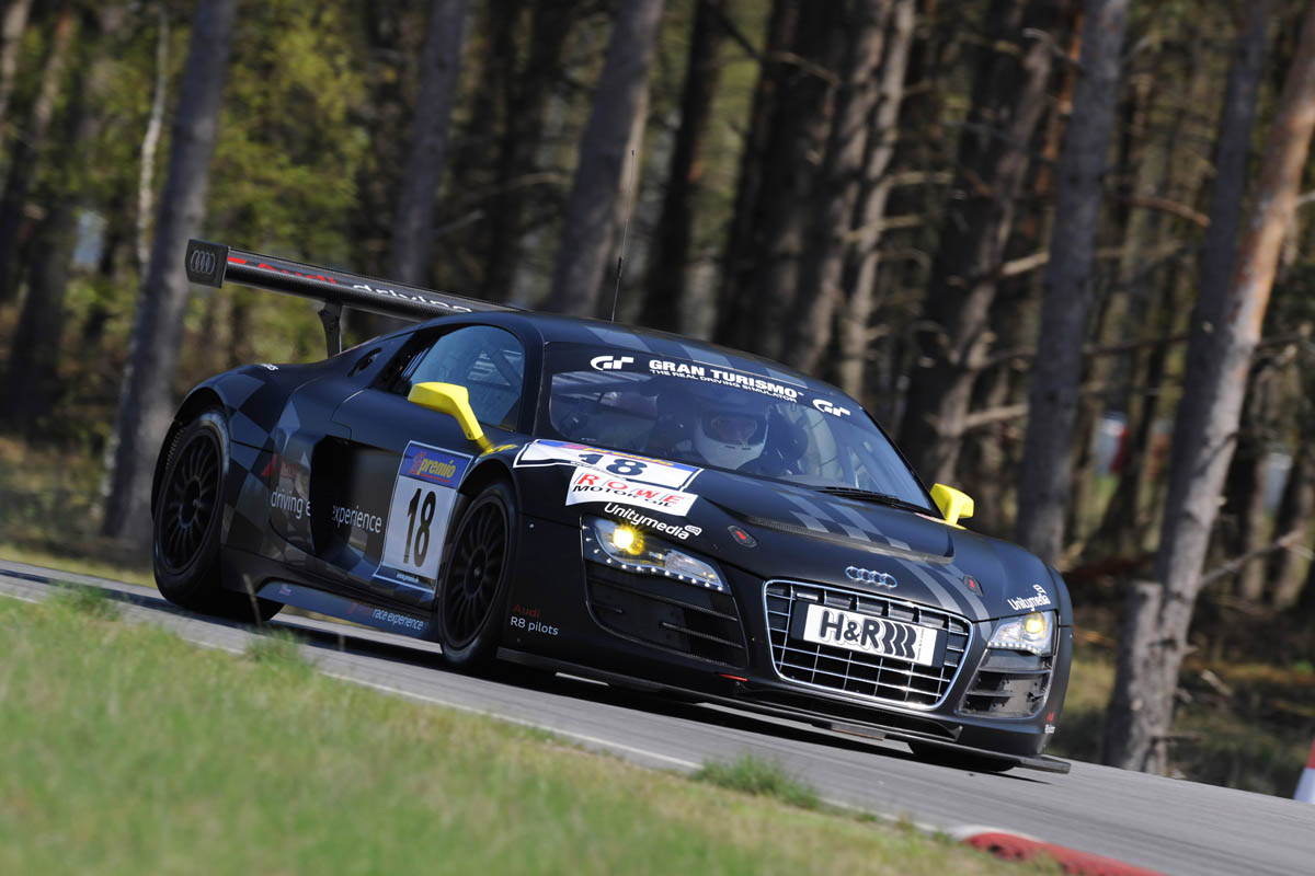 evo races an Audi R8 LMS at the Nurburgring 24 hours