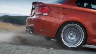 BMW 1-series M Coupe v Porsche Cayman R video review