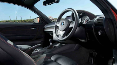 BMW 1-series M Coupe v Porsche Cayman R video review