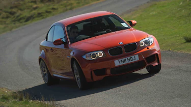 BMW 1-series M Coupe v Porsche Cayman R video review