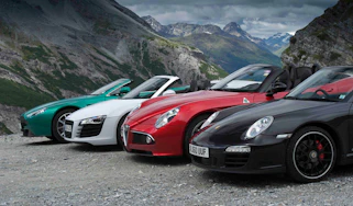 Alfa Romeo 8C Spider v Audi R8 Spyder v Aston Martin Vantage S Roadster v Porsche 911 Carrera GTS cabrio video